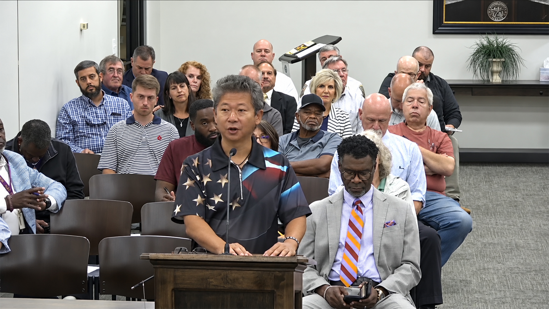 A speaker addresses Madison County commissioners from the podium during the September 23, 2026, meeting.