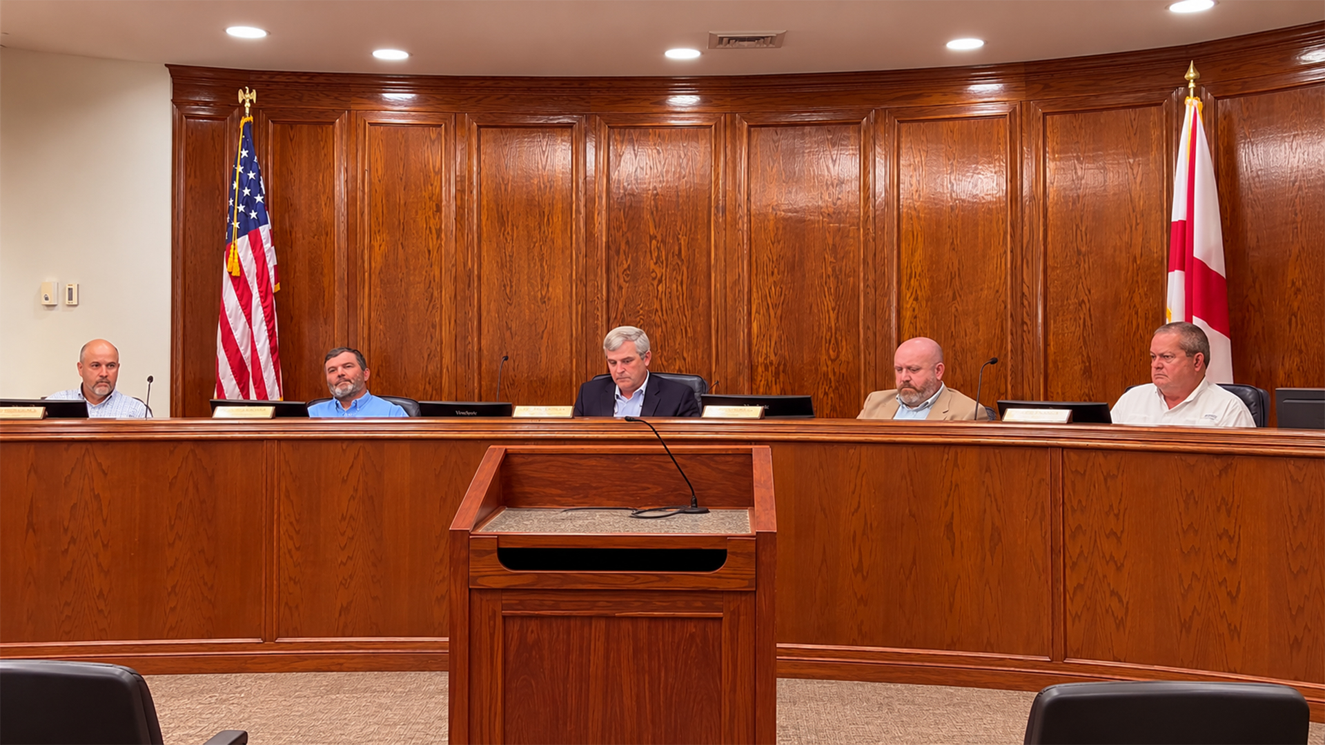 AI-assisted composite showing Autauga County commissioners seated behind the dais during the September 15, 2026, commission meeting.